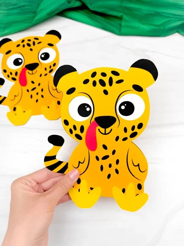 Kids crafting a Cheetah Turkey Disguise project using a free template.